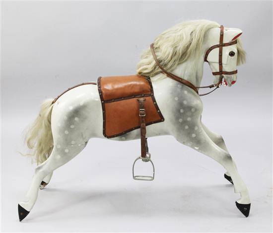 A dapple grey painted carved wood rocking horse, length 40in.